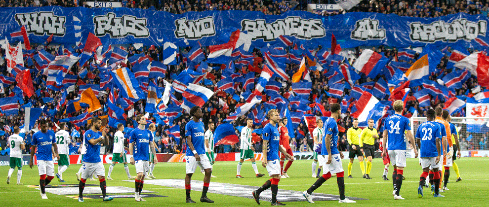 Rangers And Rapid Wien Walk Out In Front Of The Ibrox Crowd